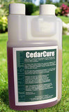 Bottle of CedarCure on a grassy background