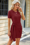 Solid color round neck pleated lace up short sleeved knitted dress